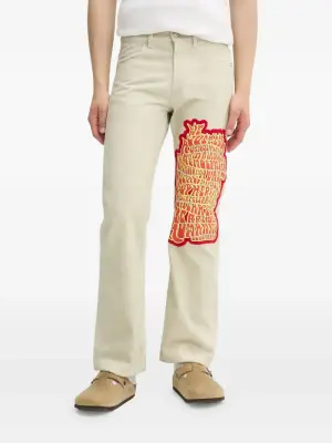 джинсы с вышивкой