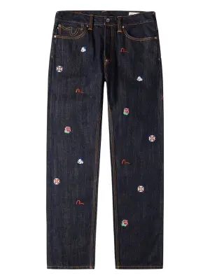 Джинсы из денима с вышивкой