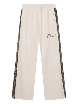 Спортивные брюки с лампасами и кружевными вставками