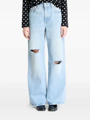 Джинсы с эффектом потертости