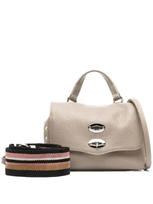 клатч с заклепками