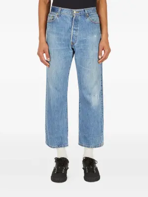 Джинсы с декоративными карманами