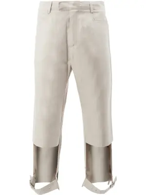 Брюки с вырезными деталями и ремешками