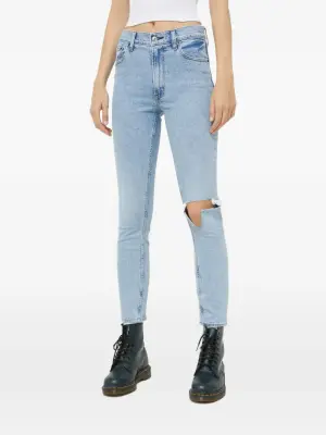 Узкие джинсы с прорезями