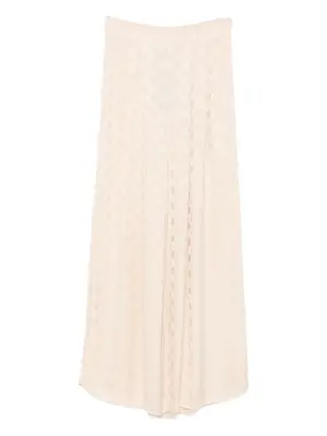 Брюки в горох со складками