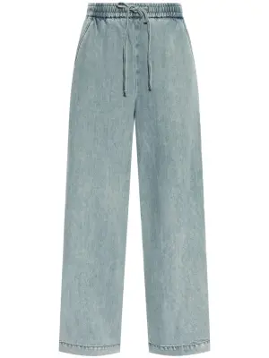 Джинсы с эффектом потертости