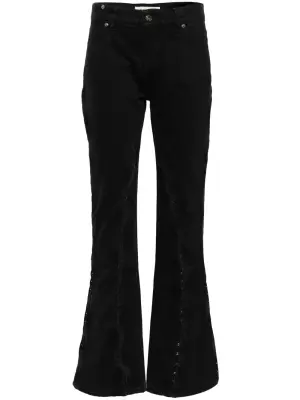 Расклешенные джинсы с крючками сбоку