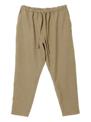 Зауженные брюки в ломаную клетку