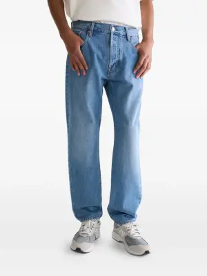 Джинсы с эффектом стирки камнями