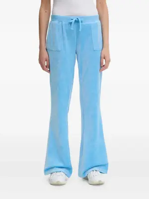 Велюровые брюки с накладными карманами