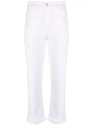 Джинсы узкого кроя с бахромой